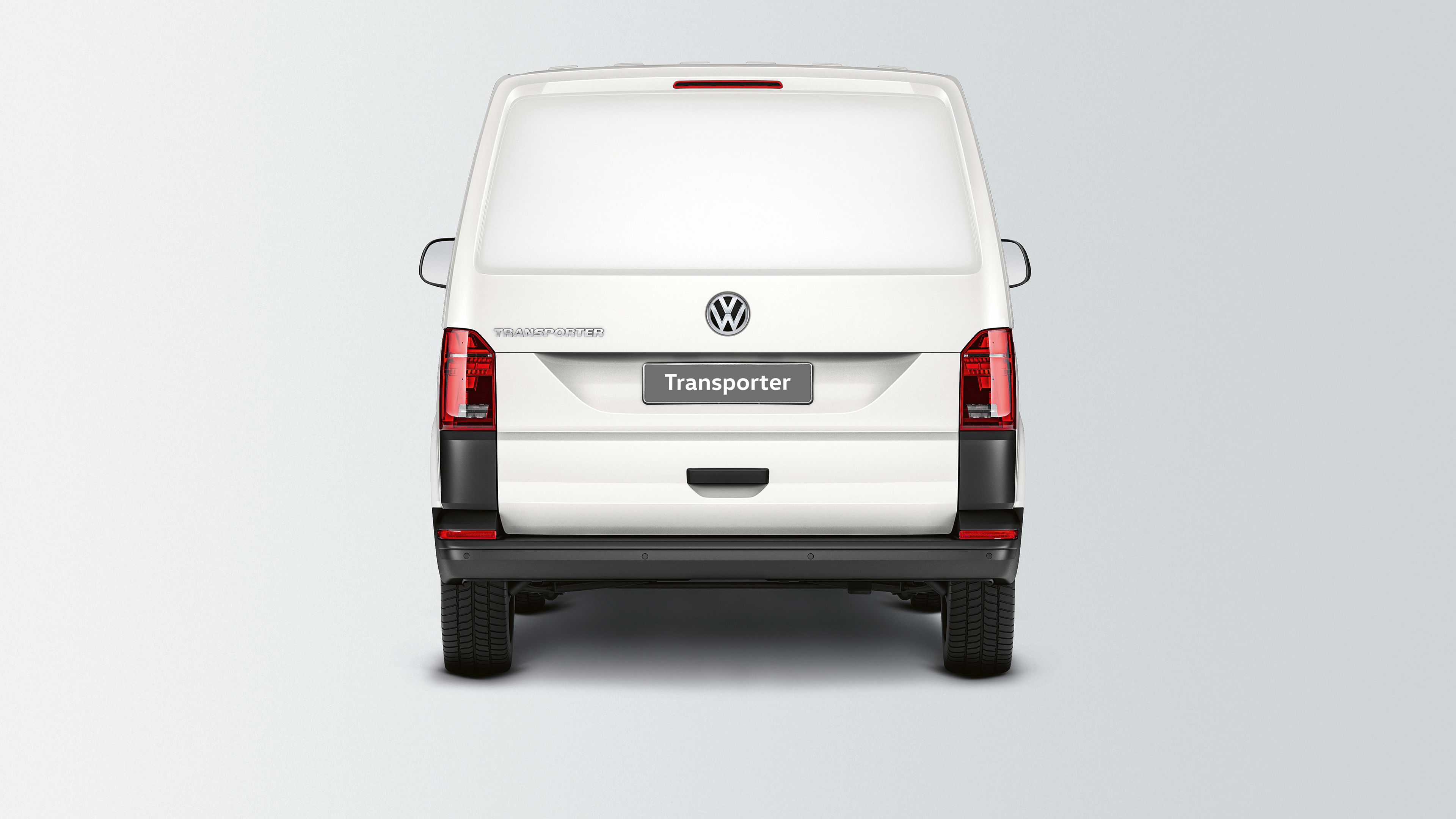 Ein VW Transporter 6.1 Kastenwagen mit Heckklappe ohne Fenster ist von hinten zu sehen.